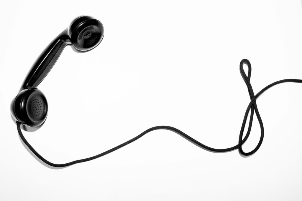 TCPA class TCPA laws black telephone white background