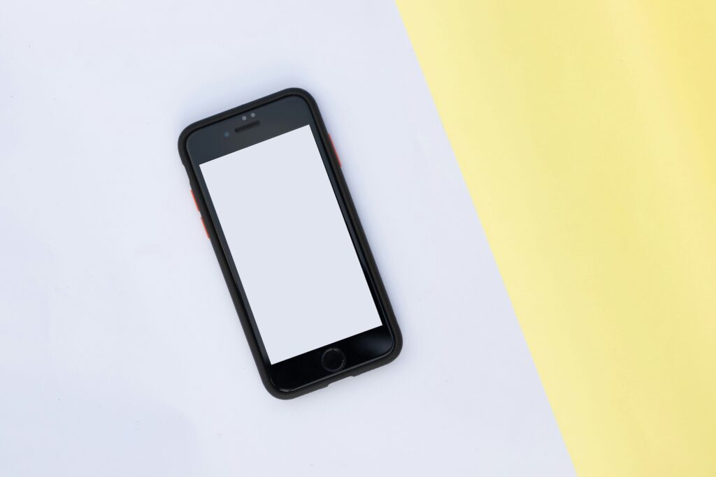 cell phone TCPA solicitation telemarketing attorney cell phone on table with yellow and white background