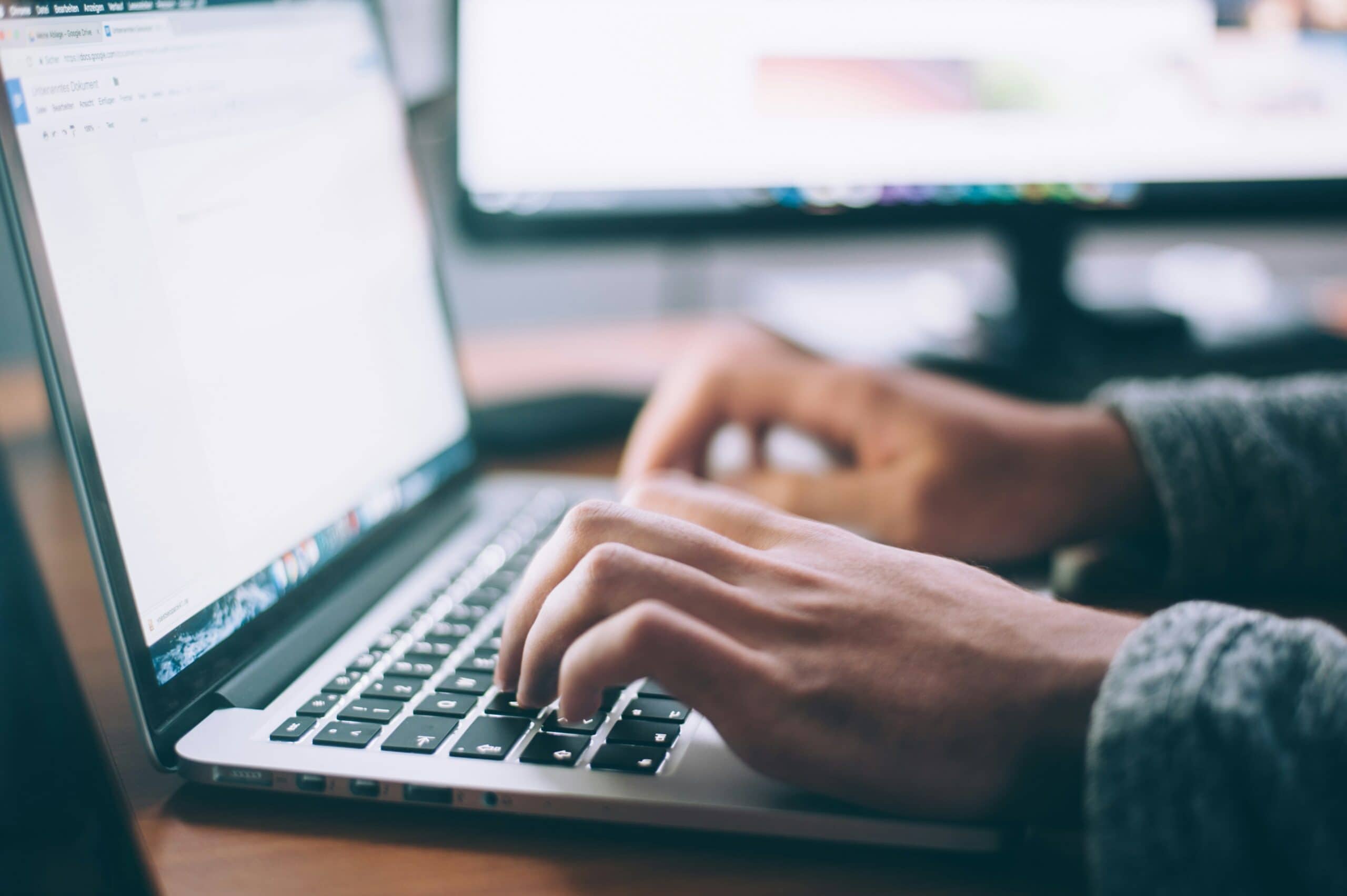 data broker registration man typing on laptop