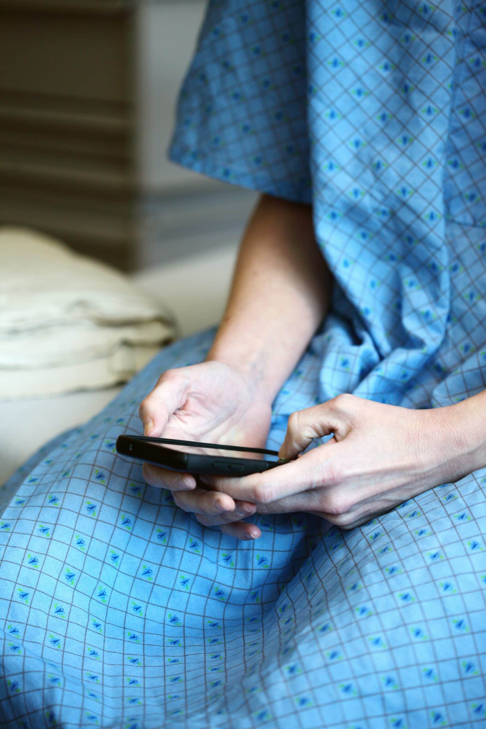 CMS rule Medicare medicaid person in hospital gown on phone