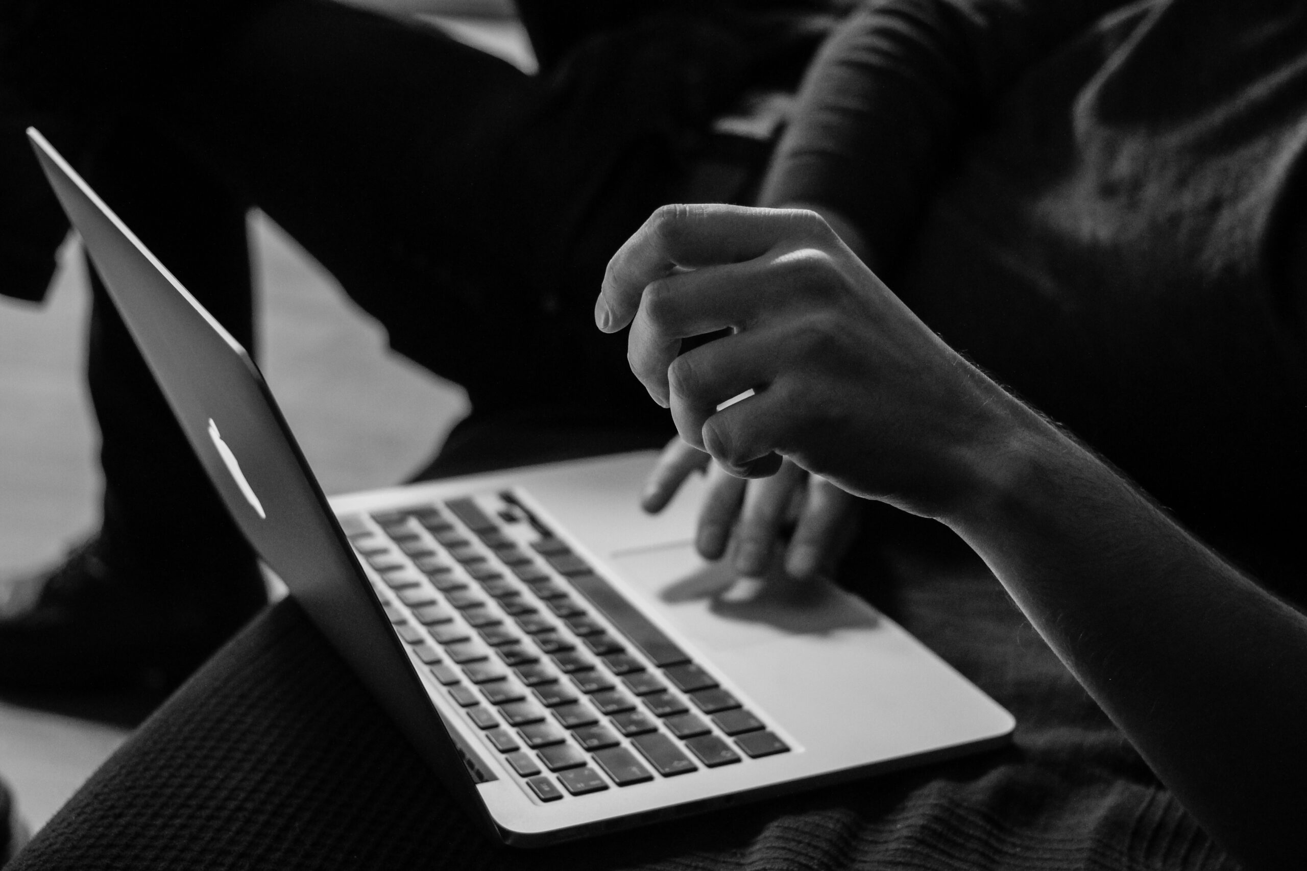 one to one consent FCC TCPA telemarketing lawyer black and white photo of guy using laptop