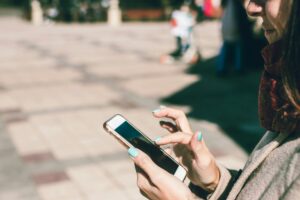 woman on phone in public TCPA telemarketing marketing FCC FTC