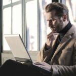 guy with beard looking confused at his laptop legal sweepstakes