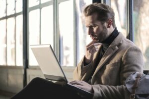guy with beard looking confused at his laptop legal sweepstakes