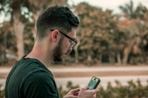 man on phone TCR registry
