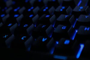internet wiretap close up of a keyboard with blue back lights