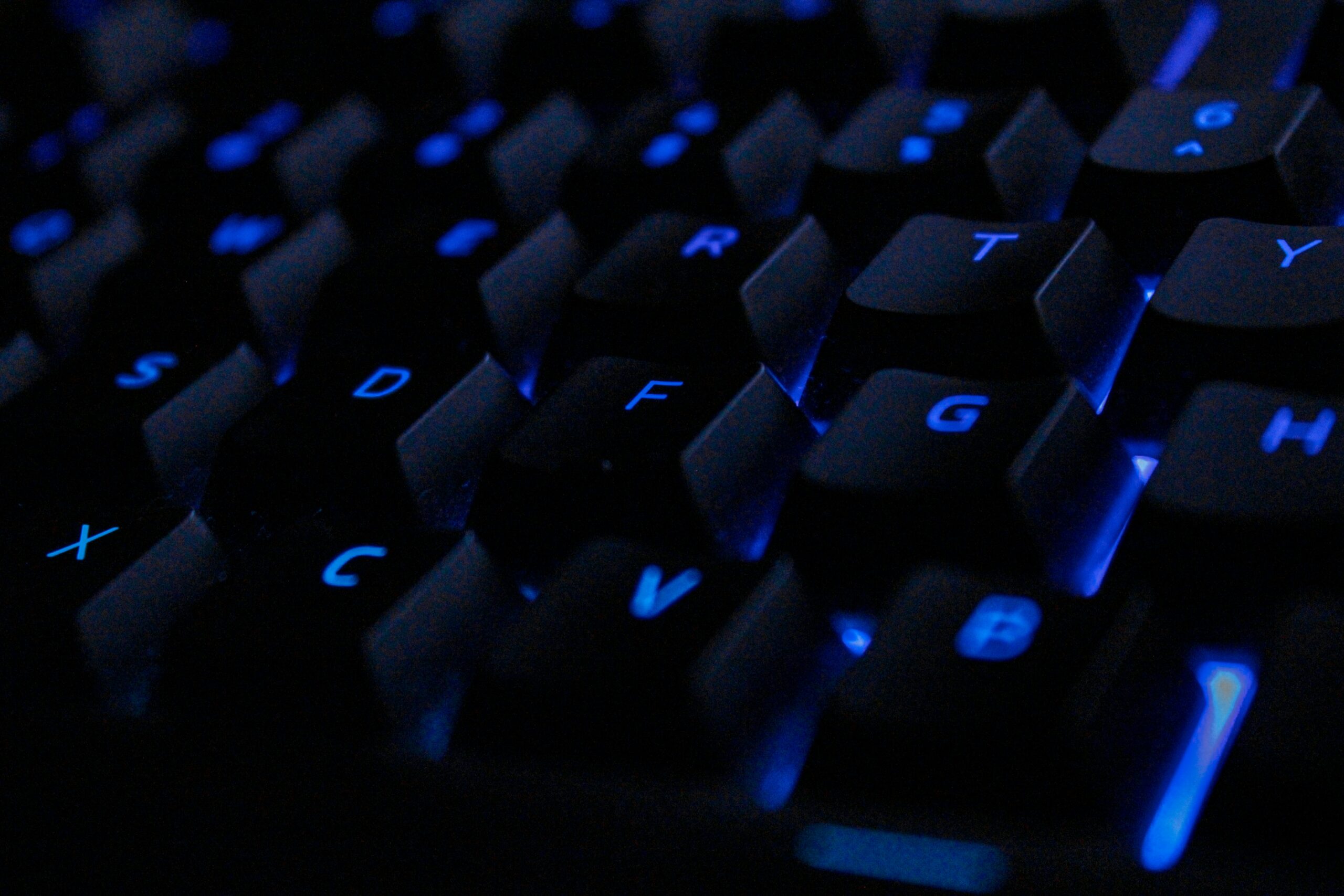 internet wiretap close up of a keyboard with blue back lights