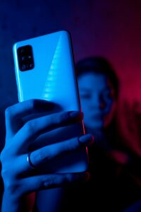 girl holding phone at night quiet hours