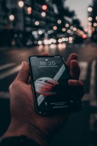 guy looking at phone with basketball on the background sports gambling advertising