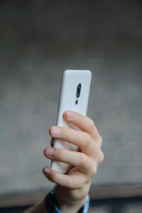 TCPA Rule man holding phone white phone