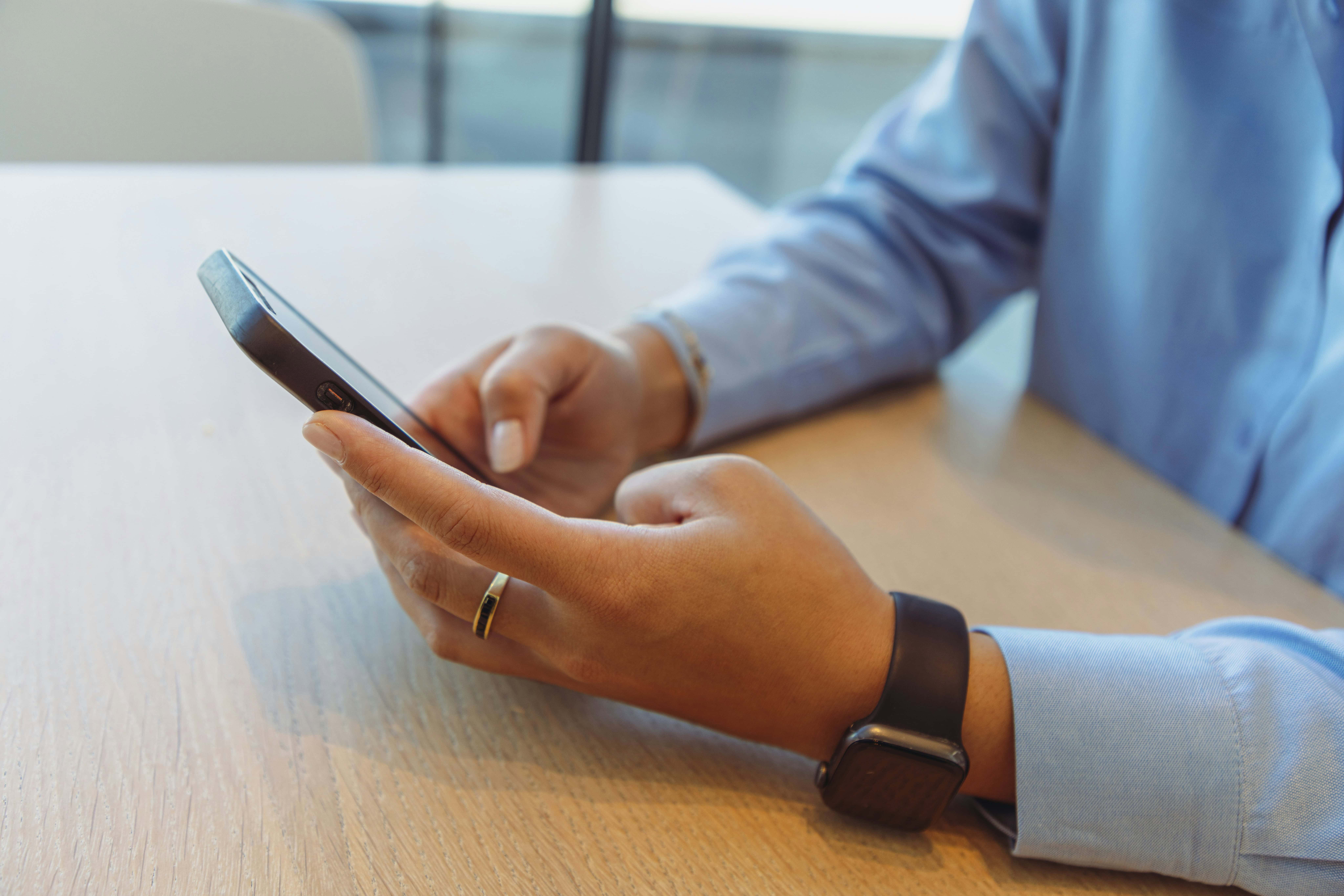 man on phone at desk with blue button down shirt daniels law lawsuit