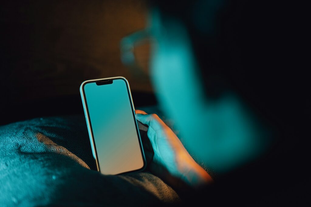 guy on his cell phone in the dark tcpa residential
