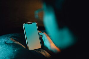 guy on his cell phone in the dark tcpa residential