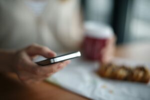 man holding phone blurry image in back DNC call donotcalllist