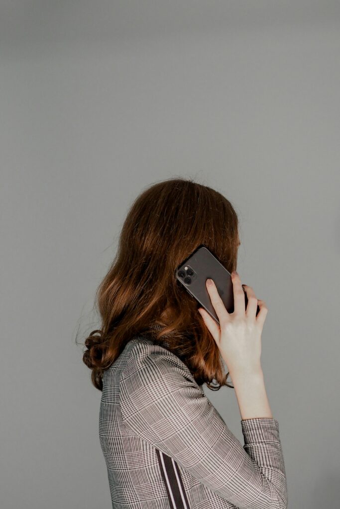 woman with red hair on her phone tcpa consent tcpa law marketing
