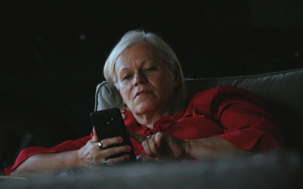 old person on their cell phone michigan telemarketing