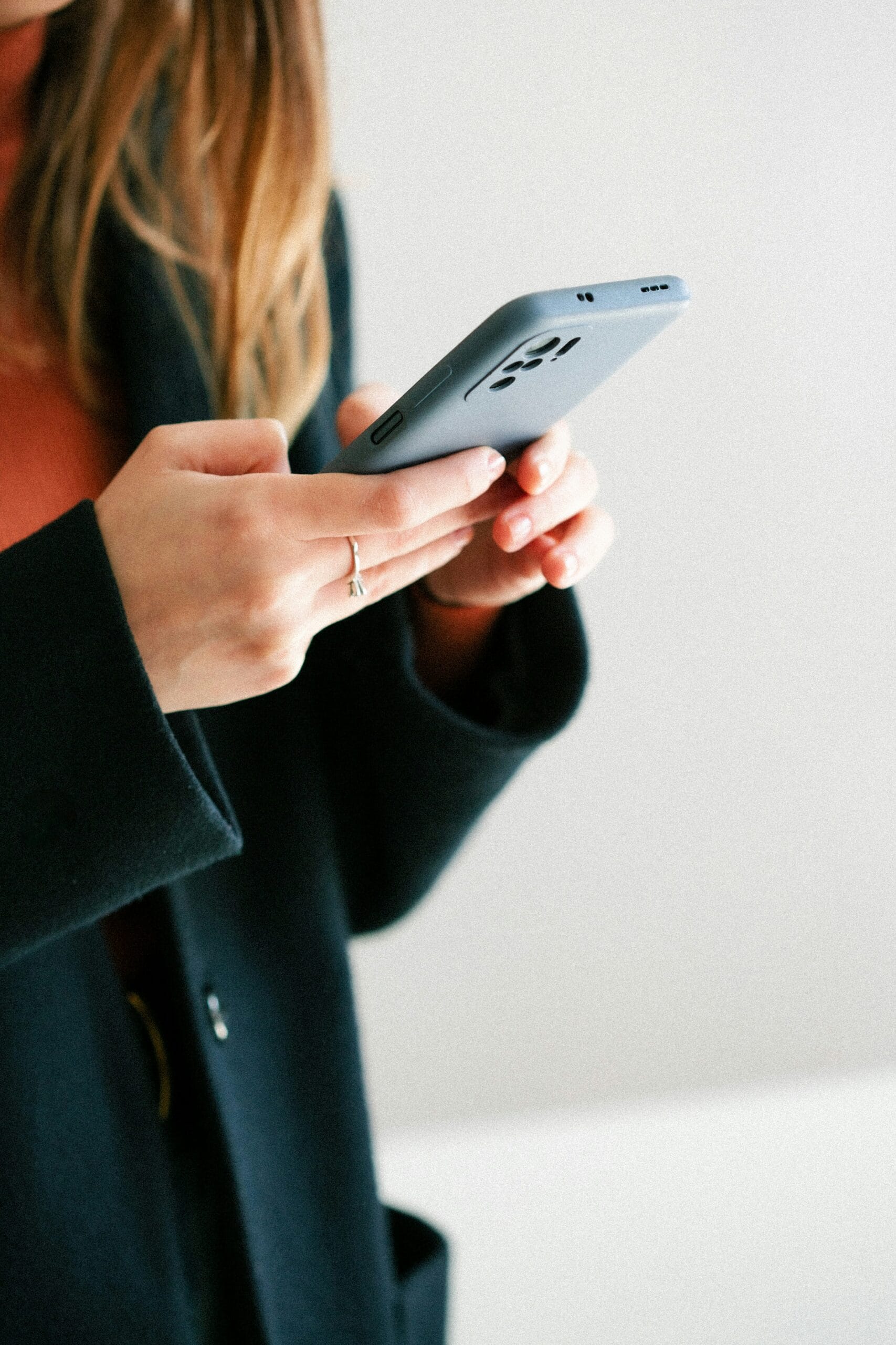 girl on phone with long hair subscription plans